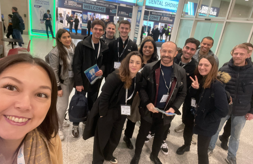 a group selfie with staff and student attending a dental showcase event