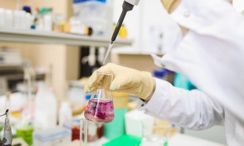 Student using chemistry equipment