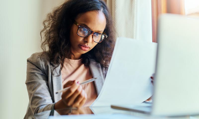 A student reviewing business documents